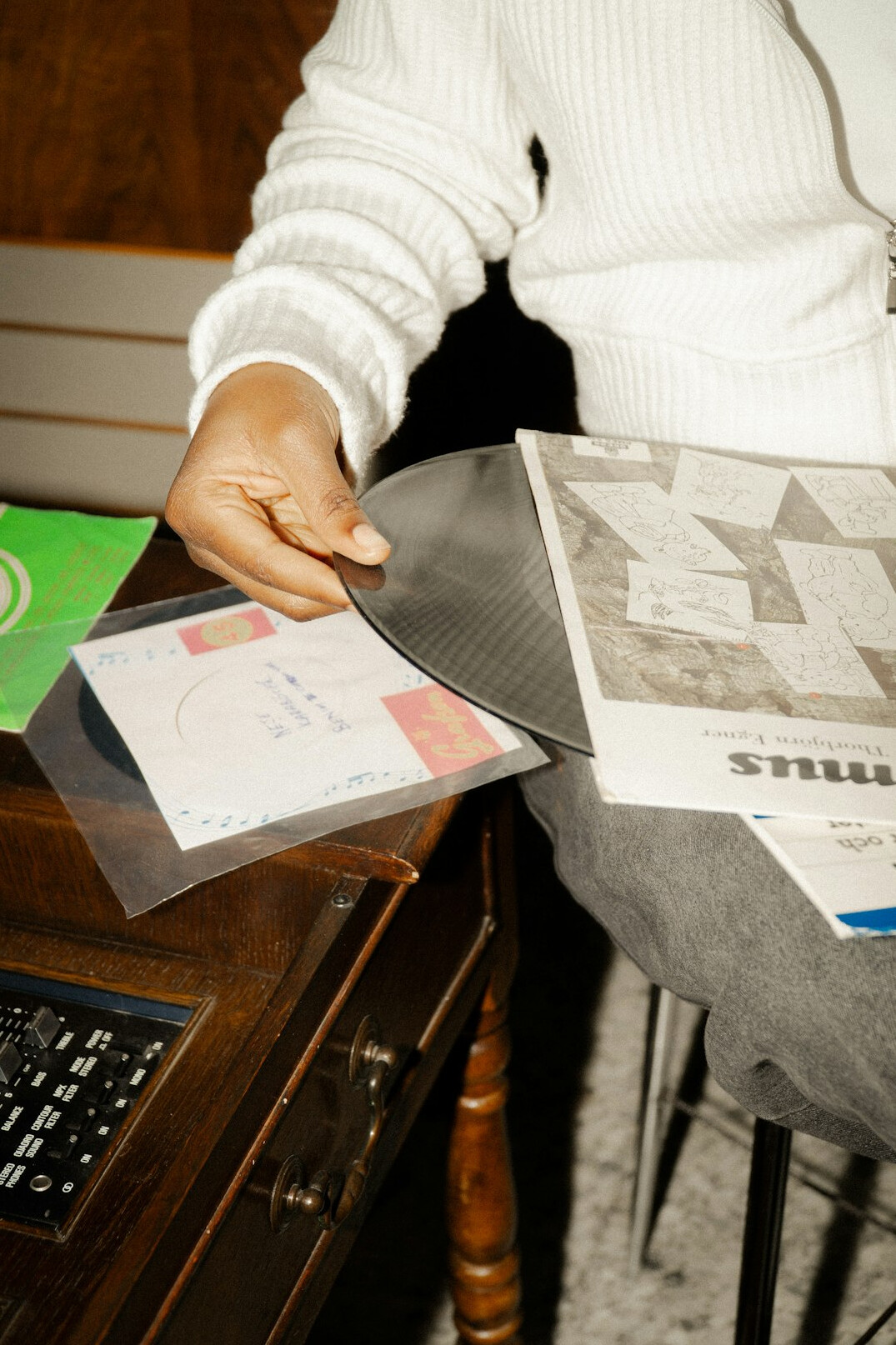 person using calculator with documents